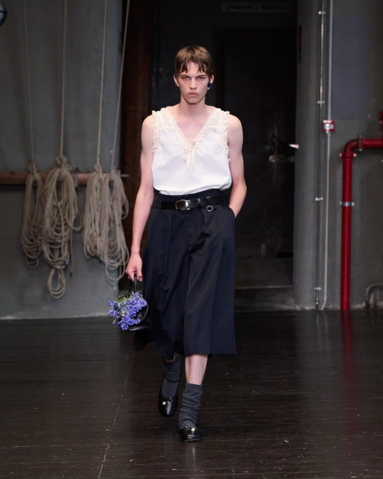 Simone Rocha SS27 Menswear Look 3 AKIM A vest in cotton poplin with ruffle trim and pressed bow